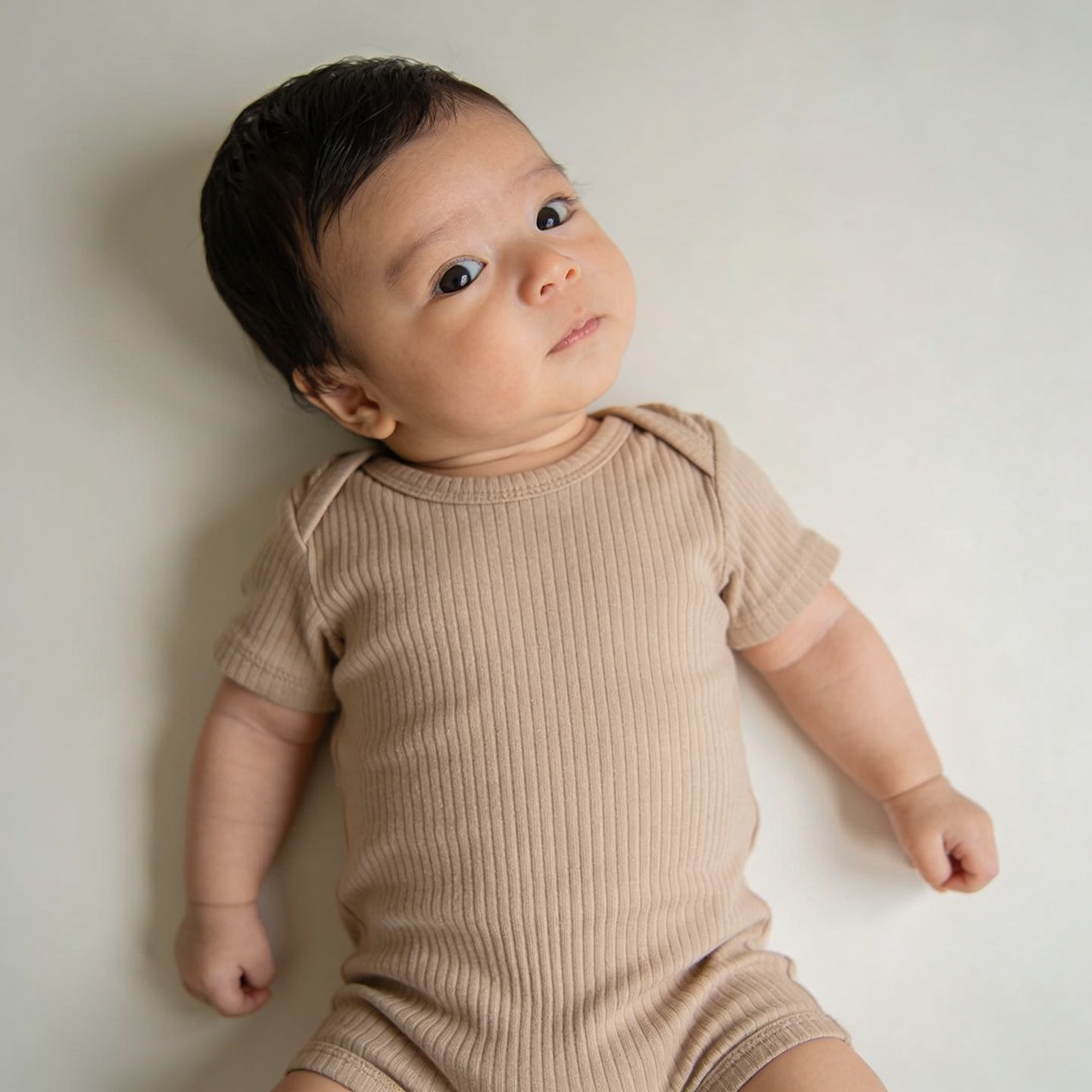 Baby with head tilt — sign of torticollis