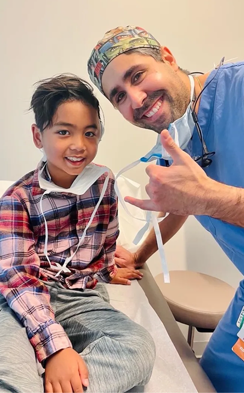 Dr Tahiri with a child