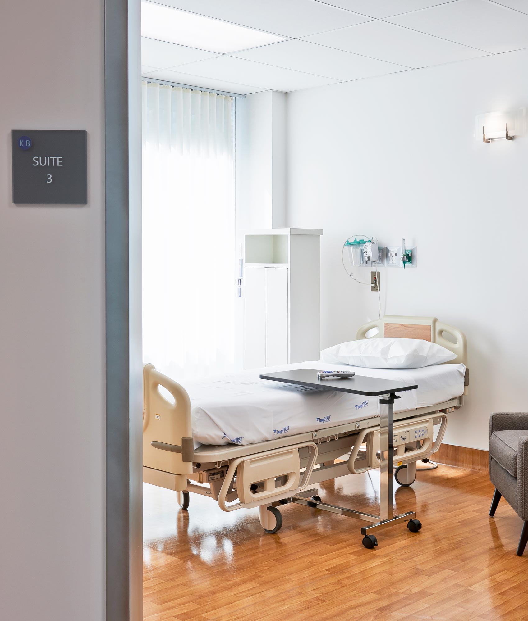 Recovery suite at K&B Surgical Center with a hospital bed and private room